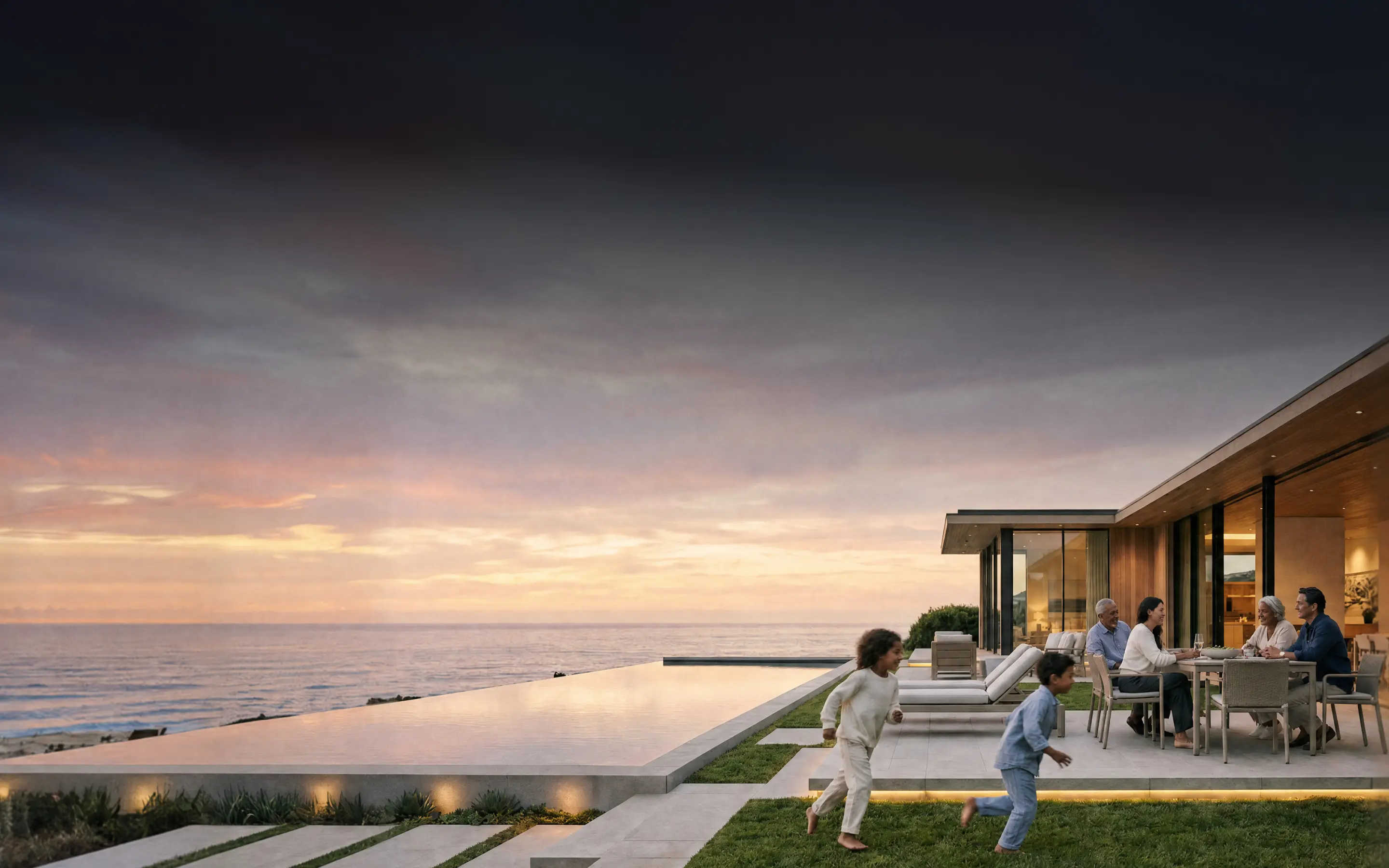 Modern luxury beachfront property at sunset with children running in the grass. Human images in this ad were created using AI.
