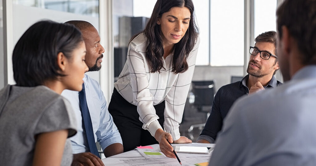 Business team discussing strategic decisions during a meeting in office