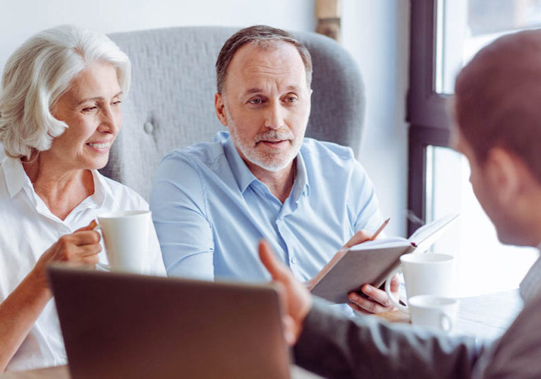Mature couple has annual review meeting with financial advisor
