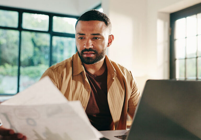 Man looks at IRA paperwork