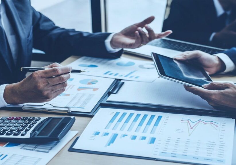 Two men reviewing numbers in meeting