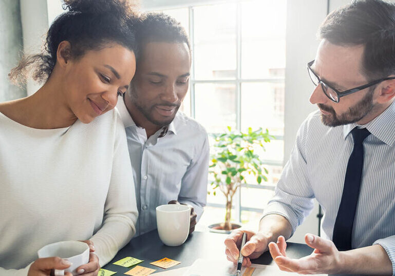 Couple meets with advisor to discuss adding life insurance to their estate plan