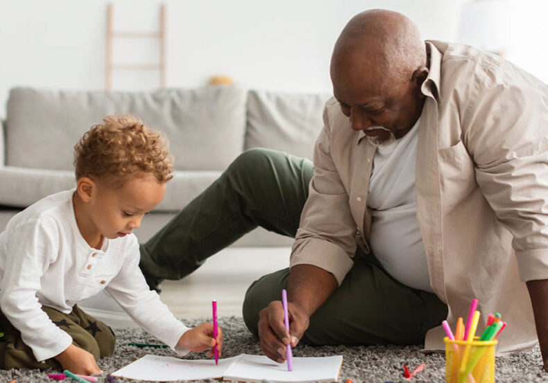 Grandpa contemplates retirement as he plays with grandson