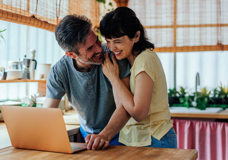 Couple reads email from advisor regarding their year-round tax planning
