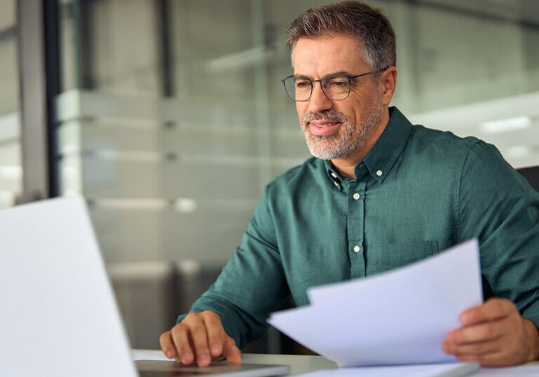 Business owner filing reports in office