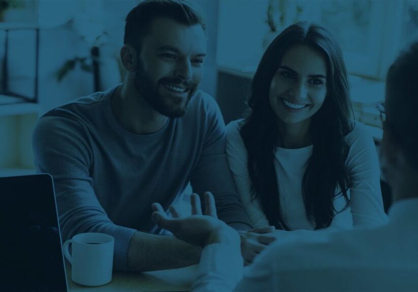 Man and woman talking to planner