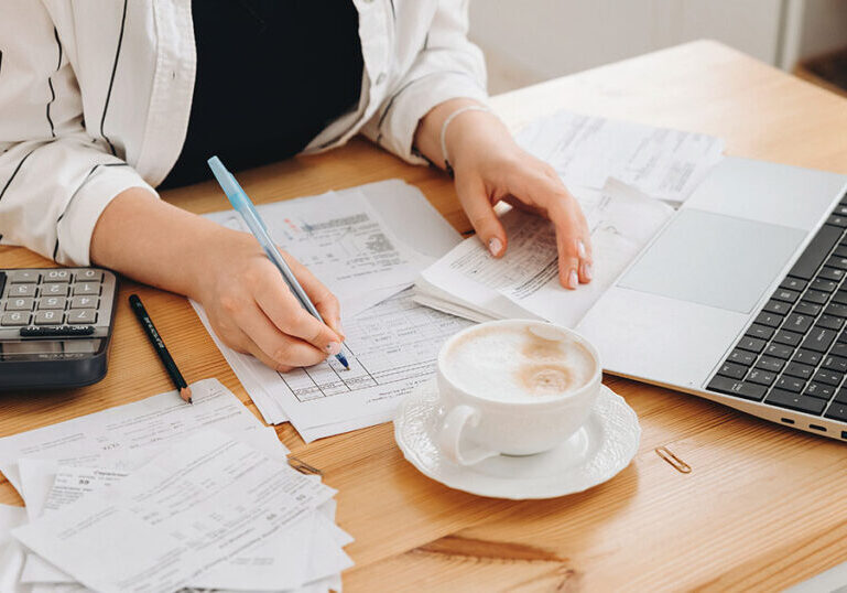 Taxpayer reviewing tax documents at her desk